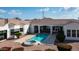 Backyard with a swimming pool and spa, covered patio, and desert landscaping create an outdoor oasis at 3126 E Fruitvale Ct, Gilbert, AZ 85297