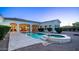 Luxurious backyard with a beautiful pool, jacuzzi, and covered patio, designed for ultimate relaxation at 3126 E Fruitvale Ct, Gilbert, AZ 85297