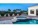 Inviting pool and jacuzzi area with lush landscaping, perfect for relaxing and entertaining outdoors at 3126 E Fruitvale Ct, Gilbert, AZ 85297