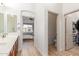 Bright primary bath with dual sink vanity, walk-in closet and private toilet room at 3131 E Legacy Dr # 2113, Phoenix, AZ 85042