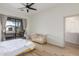 Bright bedroom with wood floors, fan, sliding doors and private balcony at 3131 E Legacy Dr # 2113, Phoenix, AZ 85042