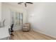 Bright bedroom with wood floors and shuttered window at 3131 E Legacy Dr # 2113, Phoenix, AZ 85042