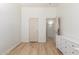 This bedroom features neutral walls, wood-look floors, and a white dresser with ample storage space at 3131 E Legacy Dr # 2113, Phoenix, AZ 85042