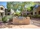 Outdoor grill station with a built in grill and counter space among lush landscaping at 3131 E Legacy Dr # 2113, Phoenix, AZ 85042