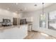 Bright kitchen featuring white cabinets, stainless steel appliances, and eat-in bar area at 3131 E Legacy Dr # 2113, Phoenix, AZ 85042
