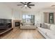 Comfortable living room features wood-look floors, a fireplace and neutral-toned sofas at 3131 E Legacy Dr # 2113, Phoenix, AZ 85042