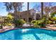 Relaxing community pool with a small waterfall feature and lush tropical landscaping at 3131 E Legacy Dr # 2113, Phoenix, AZ 85042