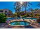 Inviting community pool and hot tub area with landscaped surroundings and clear blue sky at 3131 E Legacy Dr # 2113, Phoenix, AZ 85042