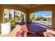 Shaded poolside seating with views of the community pool and surrounding apartment buildings at 3131 E Legacy Dr # 2113, Phoenix, AZ 85042