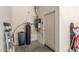 Practical utility room with water heater, water softener, and door to the garage at 3131 E Legacy Dr # 2113, Phoenix, AZ 85042