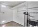 Unfinished basement with concrete floor, storage shelving and utility sink at 3251 W Mercer Ln, Phoenix, AZ 85029