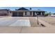 Charming single-story home featuring a two-car garage and xeriscaped front yard at 3251 W Mercer Ln, Phoenix, AZ 85029