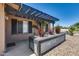 A charming porch with pergola and galvanized planter boxes full of greenery at 3251 W Mercer Ln, Phoenix, AZ 85029
