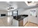 Bright kitchen offers granite counter tops and an open layout to the living area at 3251 W Mercer Ln, Phoenix, AZ 85029