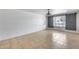 Bright living room showcases neutral tile flooring and shutters on the window at 3251 W Mercer Ln, Phoenix, AZ 85029