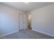 Bedroom with neutral carpet flooring and a walk-in closet at 3313 W Wayland Dr, Phoenix, AZ 85041