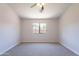 Bedroom featuring a ceiling fan and a window allowing lots of natural light at 3313 W Wayland Dr, Phoenix, AZ 85041