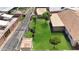 Aerial view of the backyard featuring mature trees and a storage shed at 4122 W Las Palmaritas Dr, Phoenix, AZ 85051