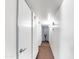 Hallway featuring neutral walls, carpeting and access to multiple rooms at 4122 W Las Palmaritas Dr, Phoenix, AZ 85051