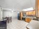 Eat in kitchen with wood cabinets, tile backsplash and black appliances at 4122 W Las Palmaritas Dr, Phoenix, AZ 85051