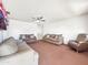 Spacious living room with neutral walls and carpeting with a ceiling fan at 4122 W Las Palmaritas Dr, Phoenix, AZ 85051
