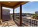 View from balcony with iron railing overlooking the community's landscaped streets and neighboring homes at 4173 E Jones St, Gilbert, AZ 85295