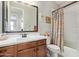 Bathroom with a vanity, toilet, and shower with a patterned curtain at 4173 E Jones St, Gilbert, AZ 85295