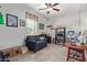 Cozy bedroom with neutral carpet, personal decor, and natural light from the window at 4173 E Jones St, Gilbert, AZ 85295