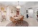 Inviting dining room with a round table, chandelier, and access to the staircase at 4173 E Jones St, Gilbert, AZ 85295