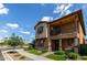 Attractive two-story home with a charming balcony, landscaped yard, and welcoming front entrance at 4173 E Jones St, Gilbert, AZ 85295