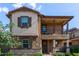 Charming two-story home with a covered porch, balcony, and landscaped front yard at 4173 E Jones St, Gilbert, AZ 85295