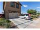 Spacious two-car garage with a driveway and well-maintained landscaping at 4173 E Jones St, Gilbert, AZ 85295
