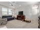 Comfortable living room with a blue sofa, decorative accents, and ample space for relaxation and entertainment at 4173 E Jones St, Gilbert, AZ 85295
