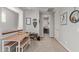 Loft area featuring a desk, storage, and a view into another room with natural light at 4173 E Jones St, Gilbert, AZ 85295