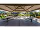 Community pavilion with multiple picnic tables, providing a shaded space for outdoor gatherings at 4173 E Jones St, Gilbert, AZ 85295