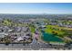 A breathtaking aerial view reveals a vast community with shimmering lakes at 420 S 80Th Pl, Mesa, AZ 85208