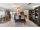 Open concept area with a decorative bar and barstools, and a view of the dining and kitchen areas at 420 S 80Th Pl, Mesa, AZ 85208