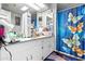 Bathroom featuring a white vanity with blue butterfly shower curtain at 420 S 80Th Pl, Mesa, AZ 85208