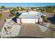 Charming home featuring a white facade, two-car garage, and desert landscaping at 420 S 80Th Pl, Mesa, AZ 85208