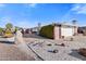 A single-story home with charming desert landscaping, a bench, and an inviting atmosphere at 420 S 80Th Pl, Mesa, AZ 85208
