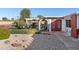 Charming single-story home with rock landscaping and decorative front entryway at 420 S 80Th Pl, Mesa, AZ 85208