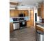 Functional kitchen with stainless steel appliances, ample counter space, and lots of storage cabinets at 420 S 80Th Pl, Mesa, AZ 85208