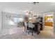 Open concept living area with a bar and barstools, and a view of the dining area at 420 S 80Th Pl, Mesa, AZ 85208
