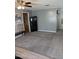 Living area with plush carpeting, and features that include a wall mounted artwork and cabinets at 420 S 80Th Pl, Mesa, AZ 85208