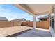 Backyard patio area with privacy wall, covered patio, and lots of potential at 42510 W Peters Dr, Maricopa, AZ 85138