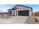 Lovely home with a two-car garage, drought-tolerant landscaping, and attractive curb appeal at 42510 W Peters Dr, Maricopa, AZ 85138