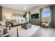 Inviting living room with neutral tones, stylish furnishings, and plenty of natural light at 42510 W Peters Dr, Maricopa, AZ 85138