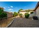 Charming backyard features low-maintenance landscaping and a detached building, perfect for outdoor enjoyment at 4326 E Cloudburst Ct, Gilbert, AZ 85297