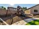 Fun backyard features a playset with swings and a slide, offering a delightful space for children at 4326 E Cloudburst Ct, Gilbert, AZ 85297