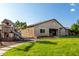 Expansive backyard featuring lush grass, play structure, and outdoor dining area for Gathering gatherings at 4326 E Cloudburst Ct, Gilbert, AZ 85297